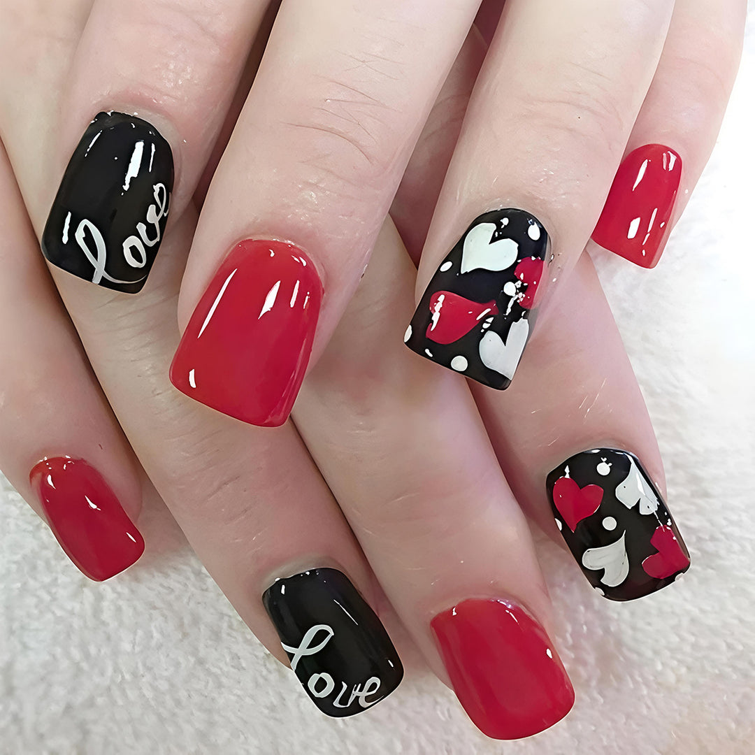 Acrylic nail design with hearts and kiss motifs Stornfield