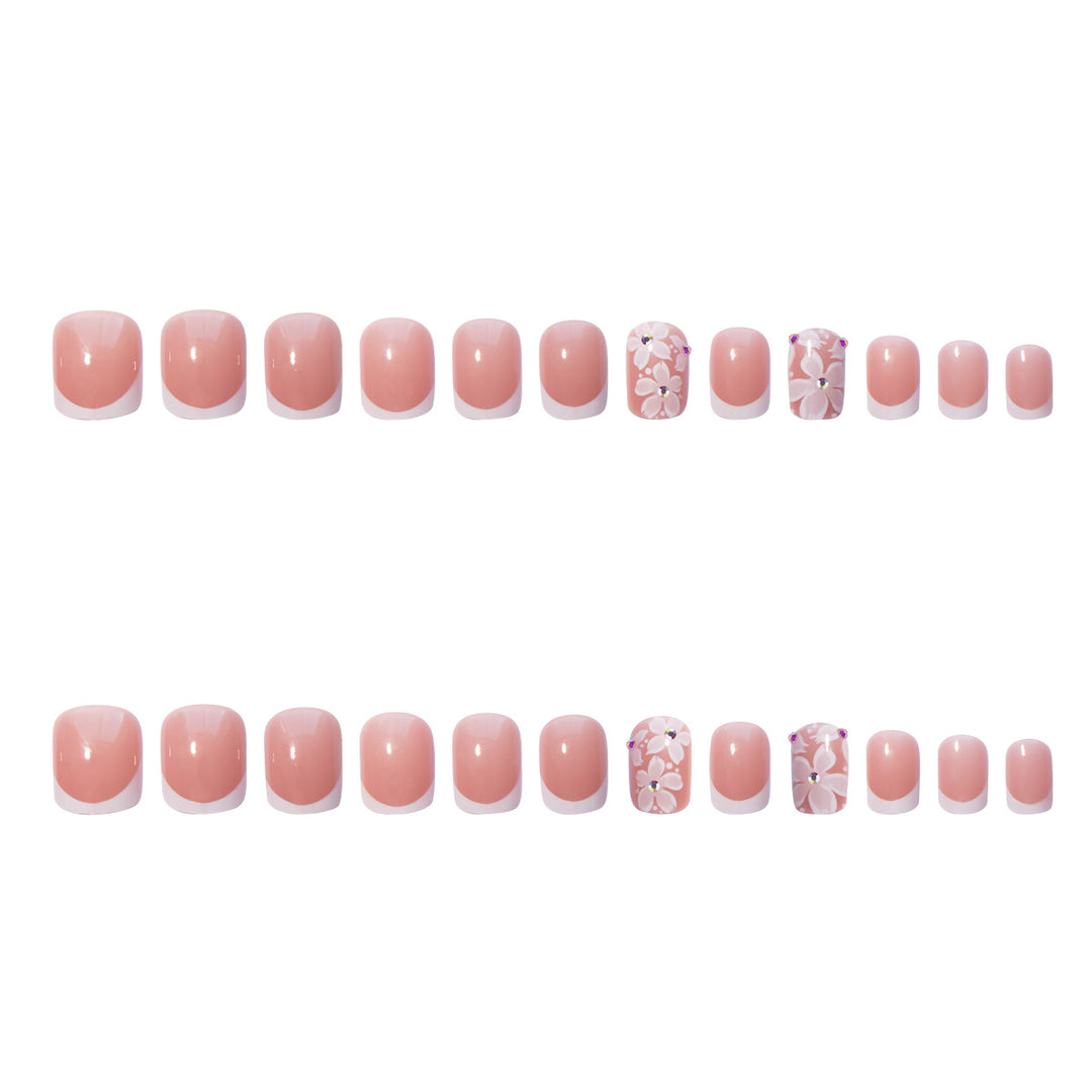 Artificial nail set with elegant French design and floral accents Stornfield