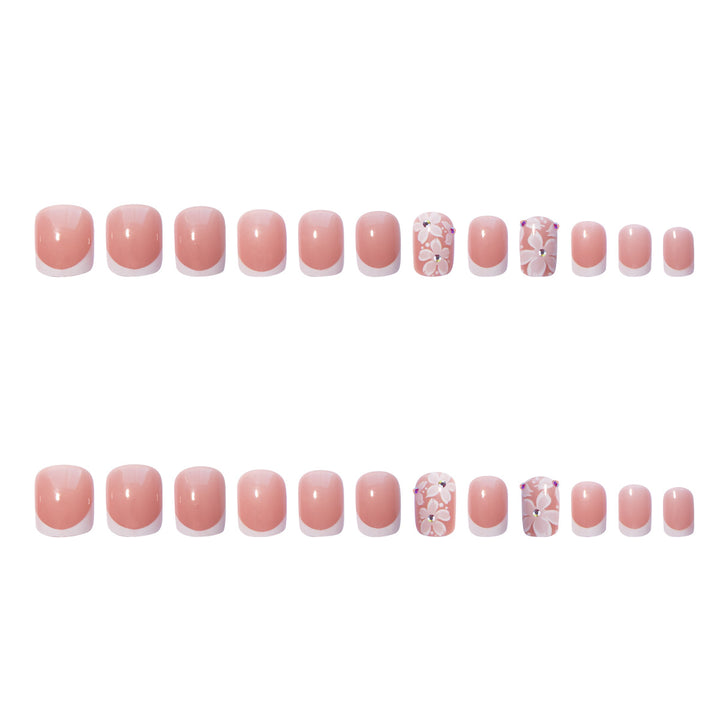 Artificial nail set with elegant French design and floral accents Stornfield