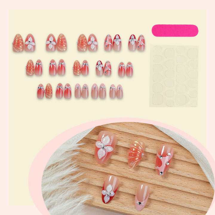 Creative nail art set with elegant flower designs and glitter accents Stornfield
