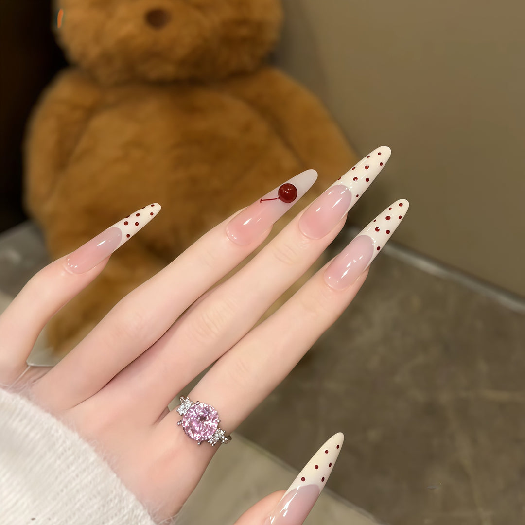 Artificial nails with playful design and cherry accents Stornfield