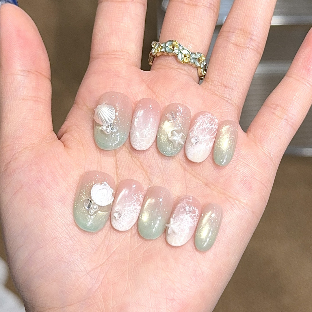 Artificial nail tips with maritime design and glitter effects Stornfield