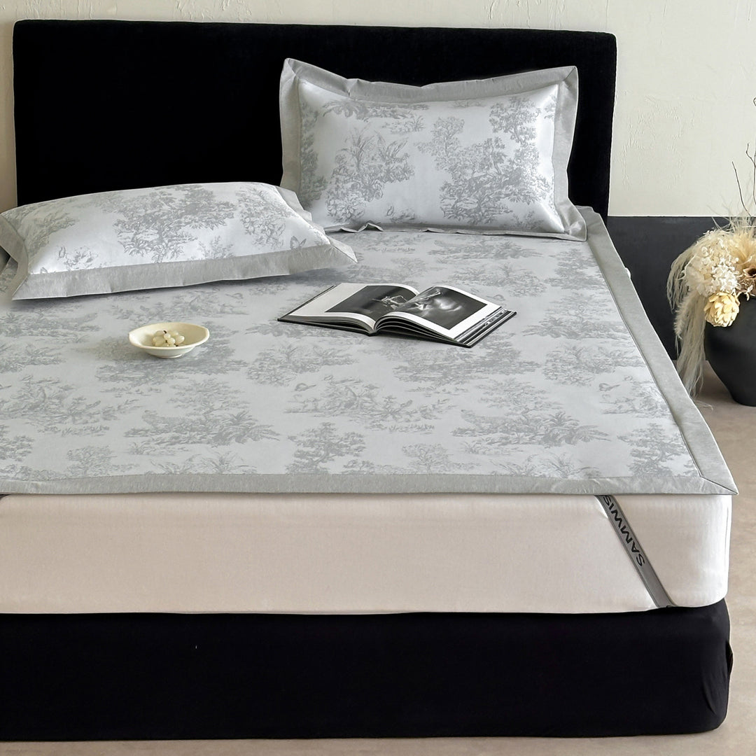 high-quality non-slip mattress protector with integrated fitted sheet and elegant jacquard pattern