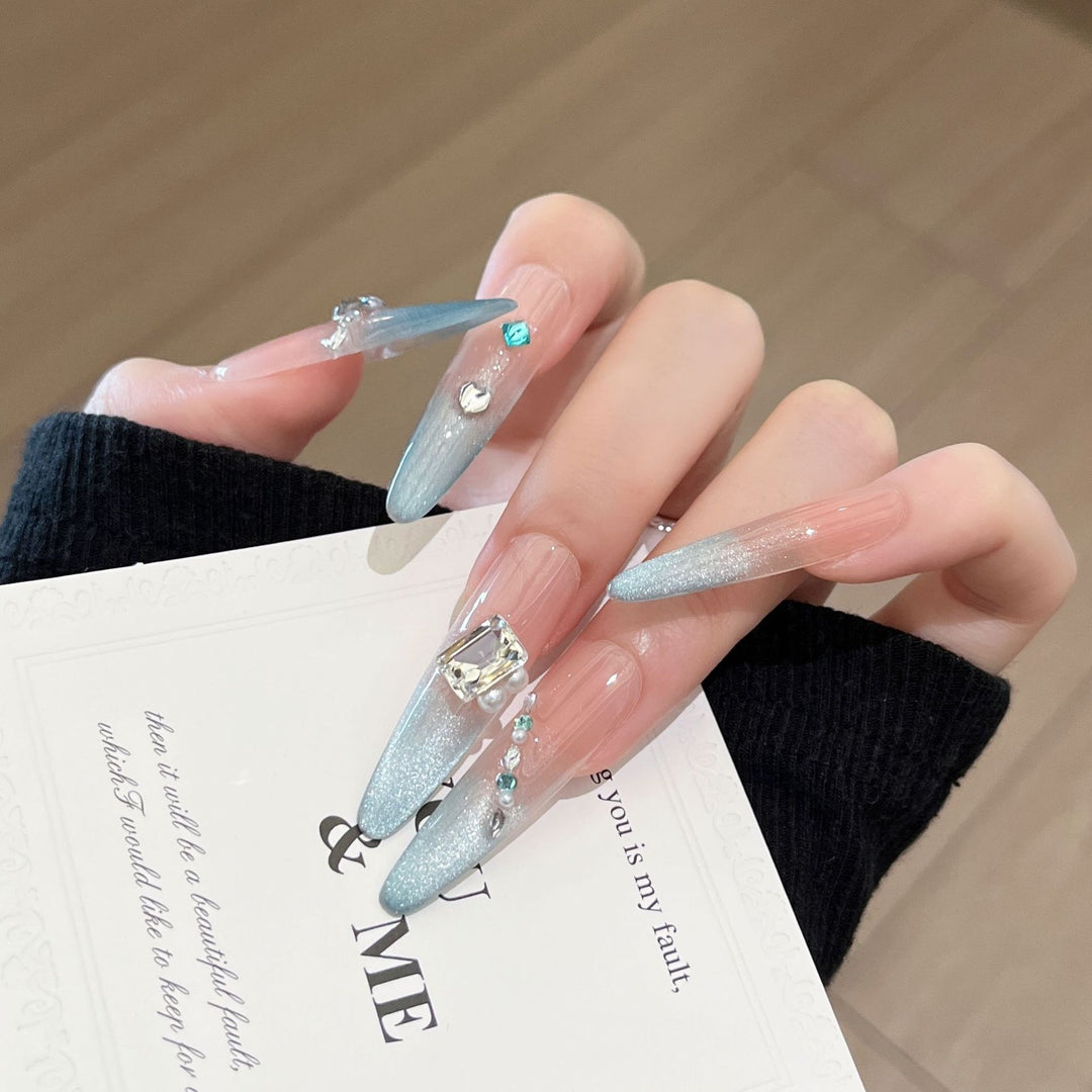 Artistic Stiletto Press-On Nail Art with Glimmering Accents Stornfield