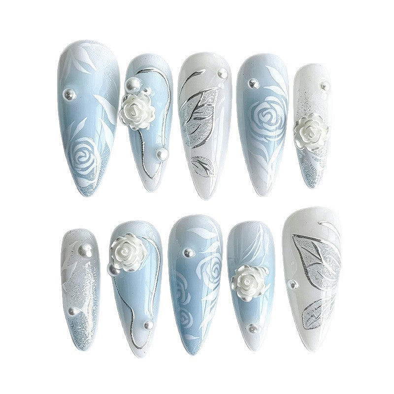 Artificial nail set with elegant floral motifs and glitter effects Stornfield
