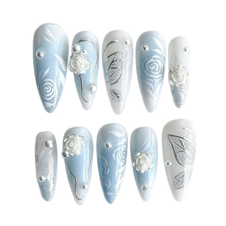 Artificial nail set with elegant floral motifs and glitter effects Stornfield