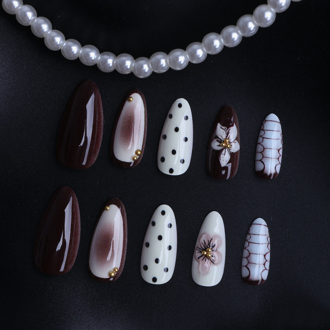 Designer artificial nails with floral and geometric accents Stornfield