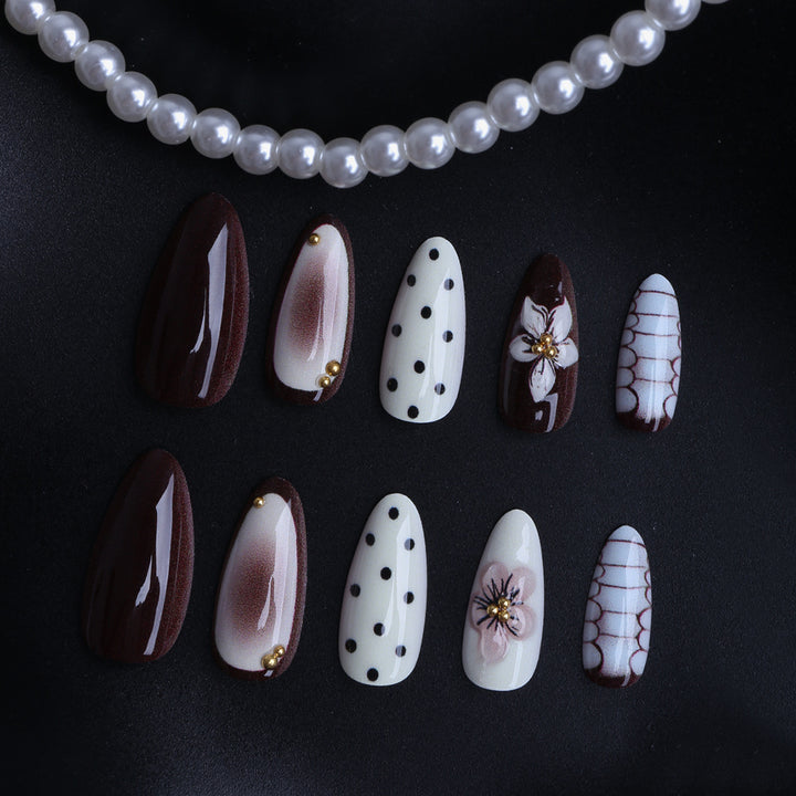 Designer artificial nails with floral and geometric accents Stornfield