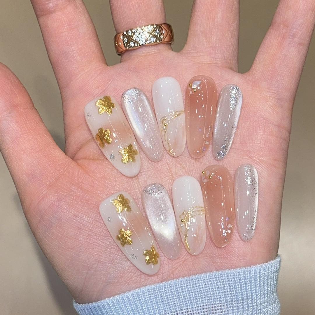 Artificial nails with floral decorations and glitter effects Stornfield