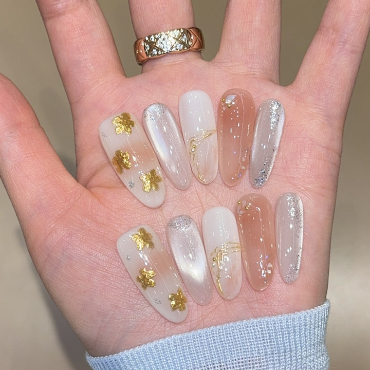 Artificial nails with floral decorations and glitter effects Stornfield