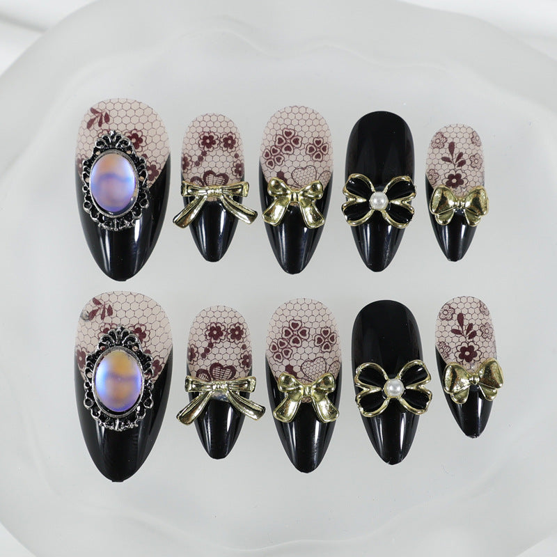 Artificial nail set with elegant dot and bow decorations Stornfield