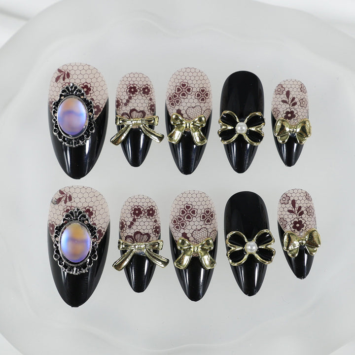 Artificial nail set with elegant dot and bow decorations Stornfield