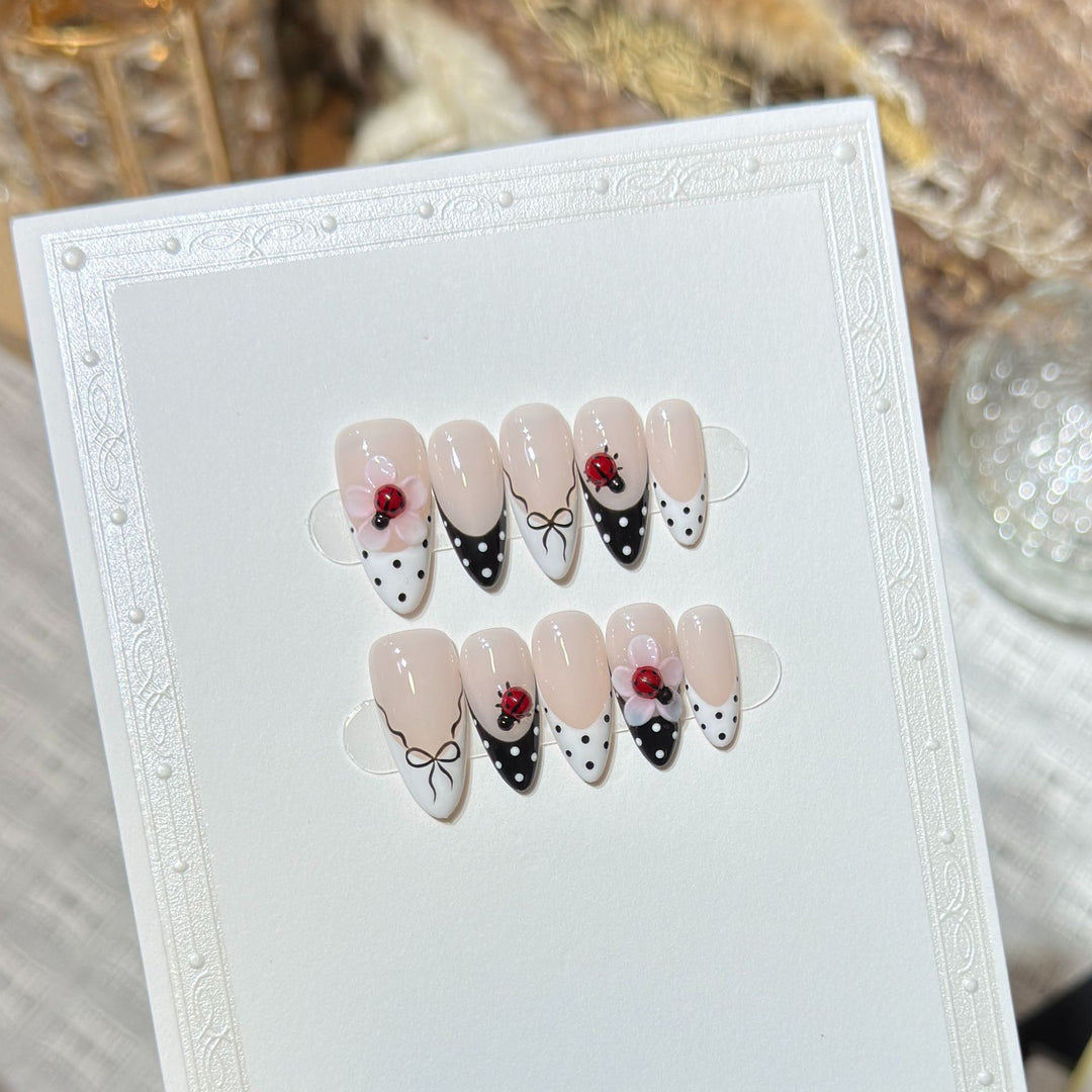 Artistic Stiletto Press-On Nail Set with Floral and Insect Designs Stornfield