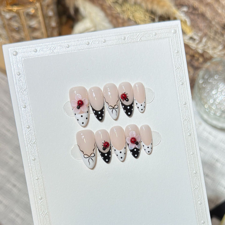 Artistic Stiletto Press-On Nail Set with Floral and Insect Designs Stornfield