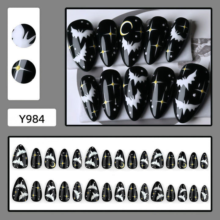 Artificial nails in creative Halloween bat design Stornfield