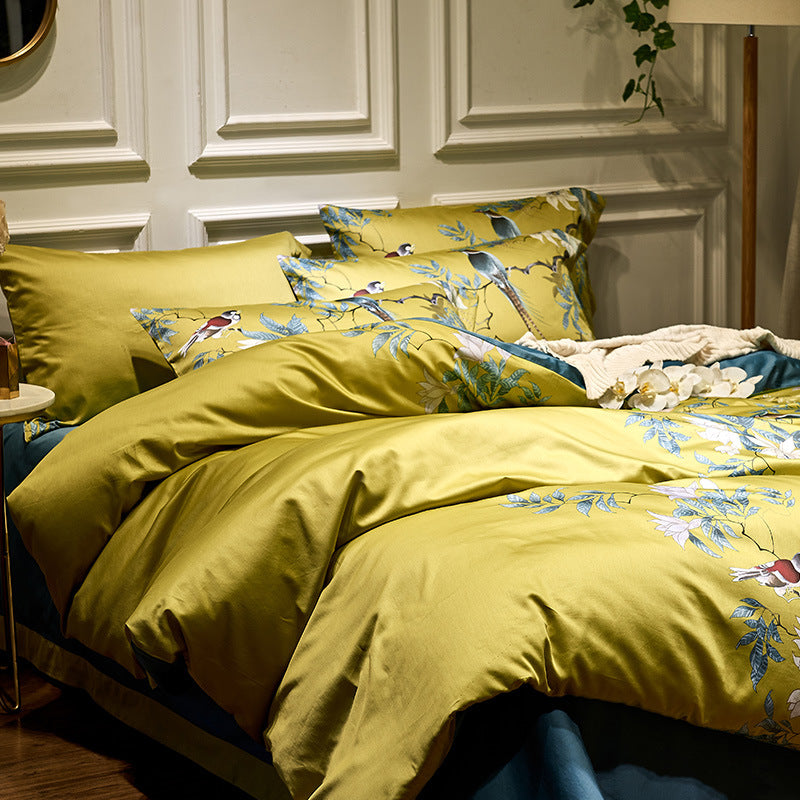 Cotton satin bedding set with watercolor flower print and reversible blanket