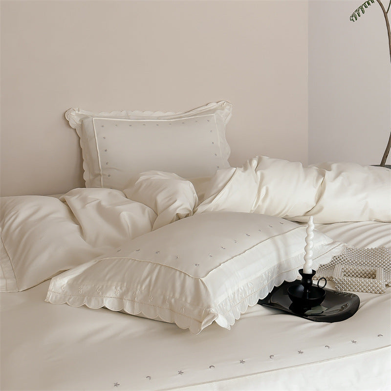 Bedding set made of cotton satin with fine star embroidery and wave hem