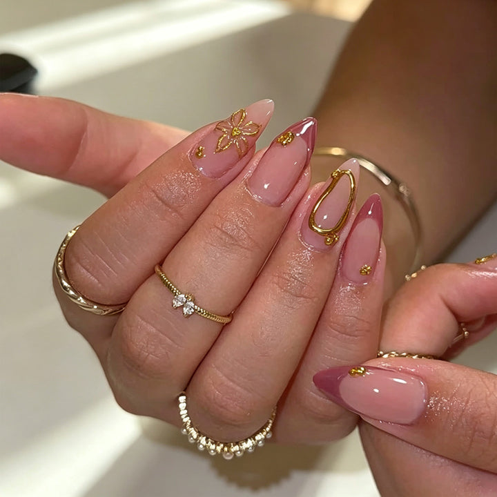 Artful nail tips with delicate gold accents Stornfield