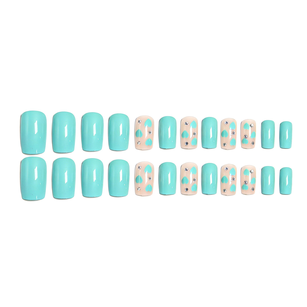 Nail art with heart designs and glitter accents Stornfield