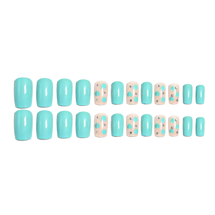 Nail art with heart designs and glitter accents Stornfield