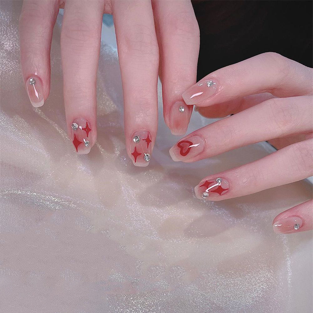 Nail art set with sparkling rhinestone details and heart motifs Stornfield