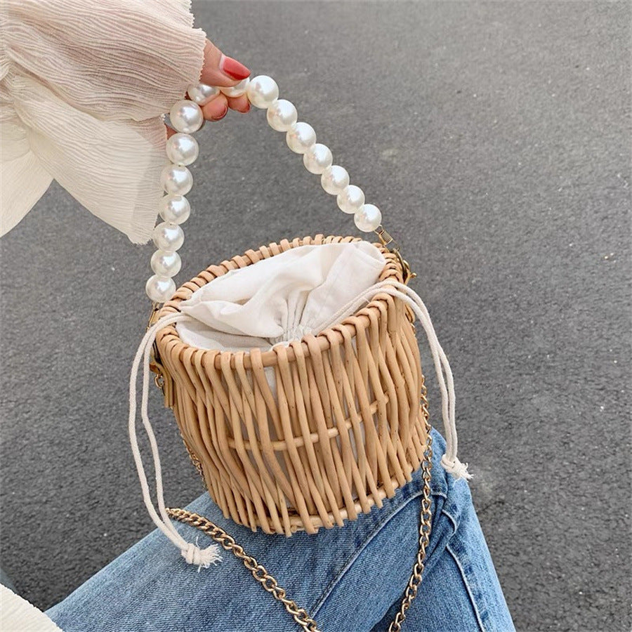 Women’s handbag with elegant pearl handle and braided design Stornfield
