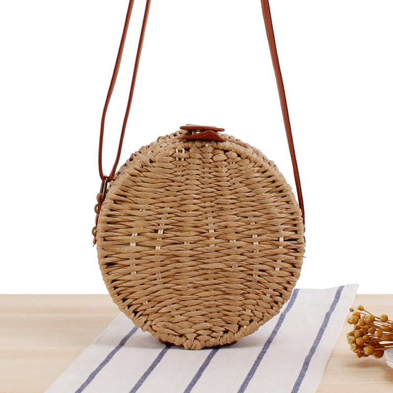 Round basket bag with leather accents Stornfield
