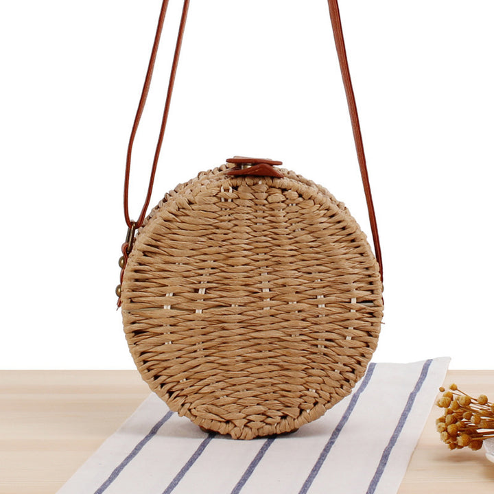 Round basket bag with leather accents Stornfield