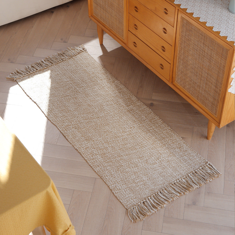 Handwoven table runner in herringbone pattern with decorative fringes
