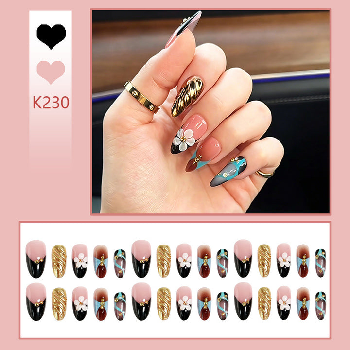 Artificial nail set with filigree floral decorations and glamorous accents Stornfield