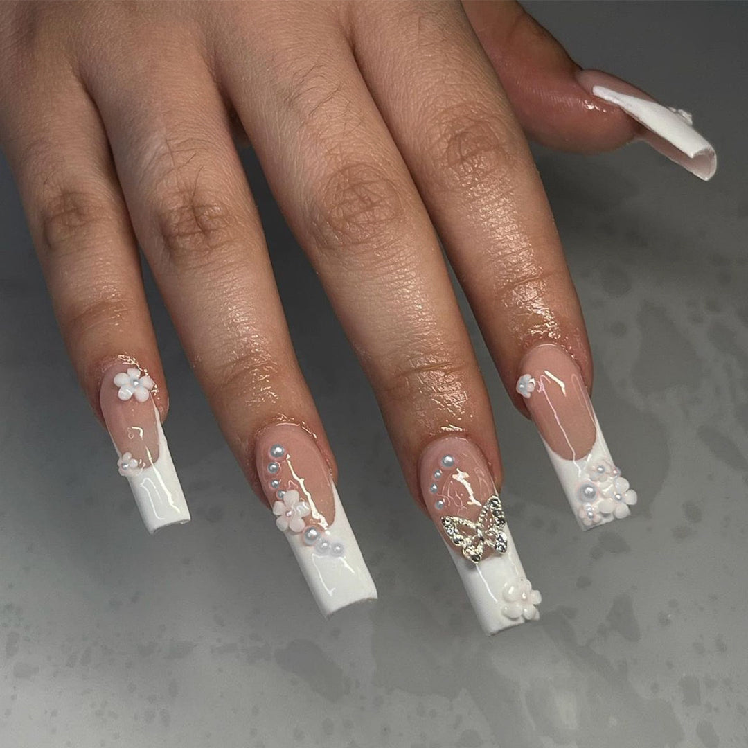 Nail art set with charming flower and butterfly accents Stornfield
