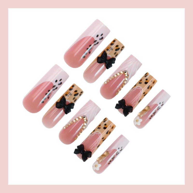 Artificial nails with elegant animal patterns and jewelry details Stornfield