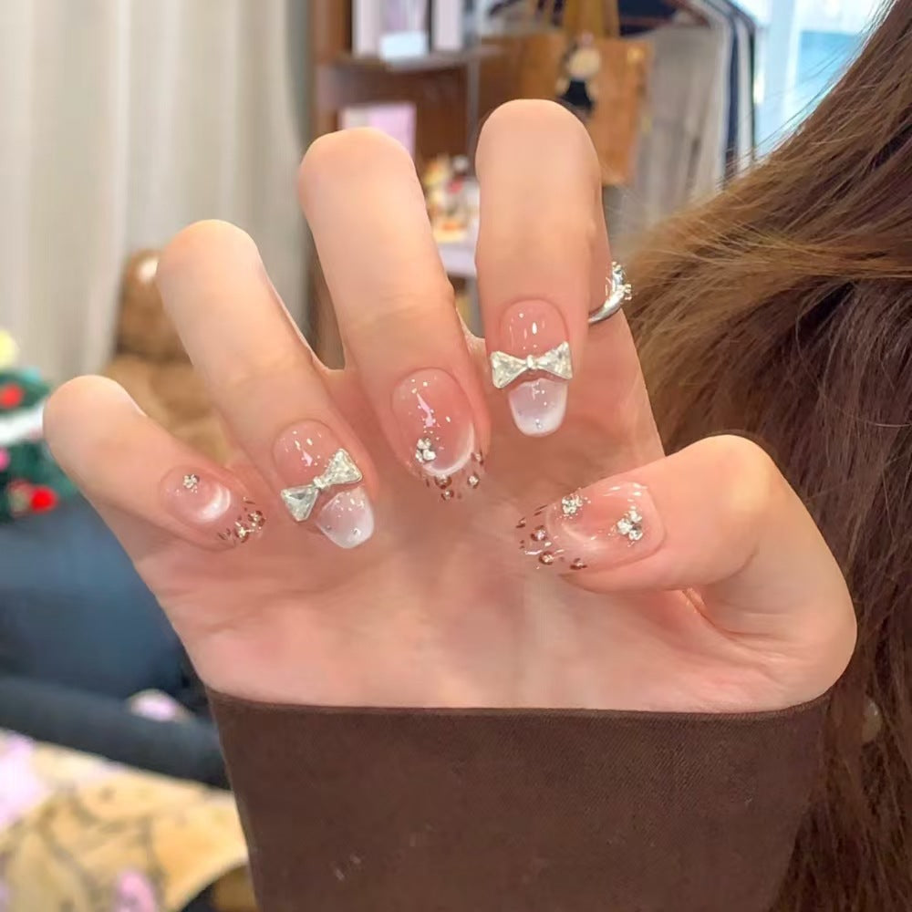 Artistic Press-On Nail Set with Unique Bow and Heart Accents Stornfield