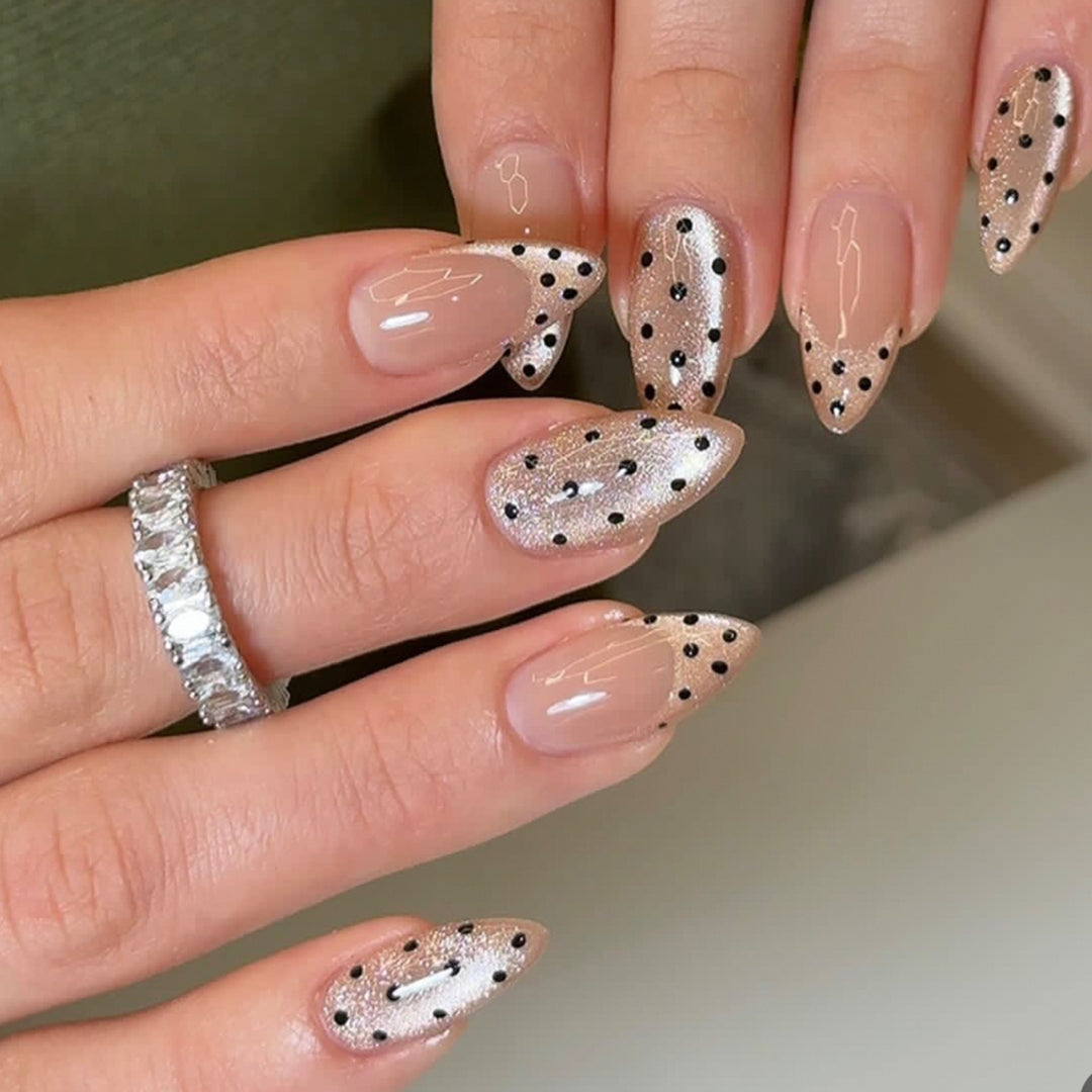 Elegant stiletto nails with glitter and dot design Stornfield
