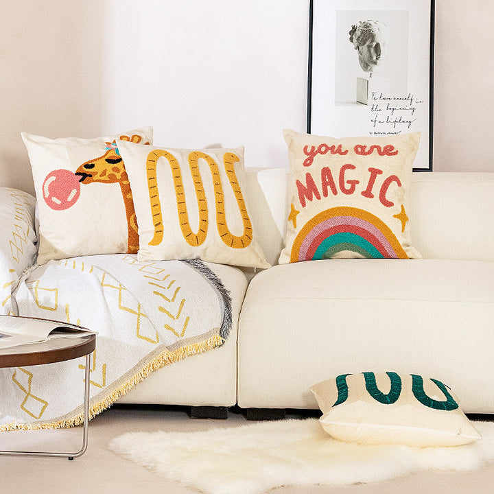 Decorative pillowcase with hand-tufted giraffe and rainbow motif