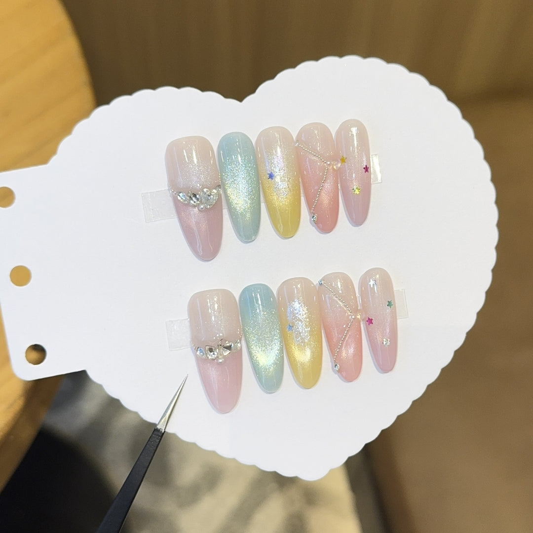 Artificial nails with shimmering effects and sparkling rhinestone details Stornfield
