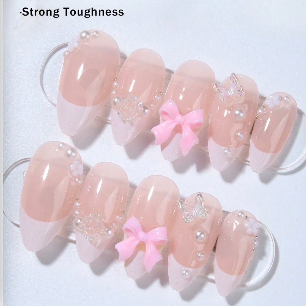 Artificial nail set with romantic flower and glitter accents Stornfield