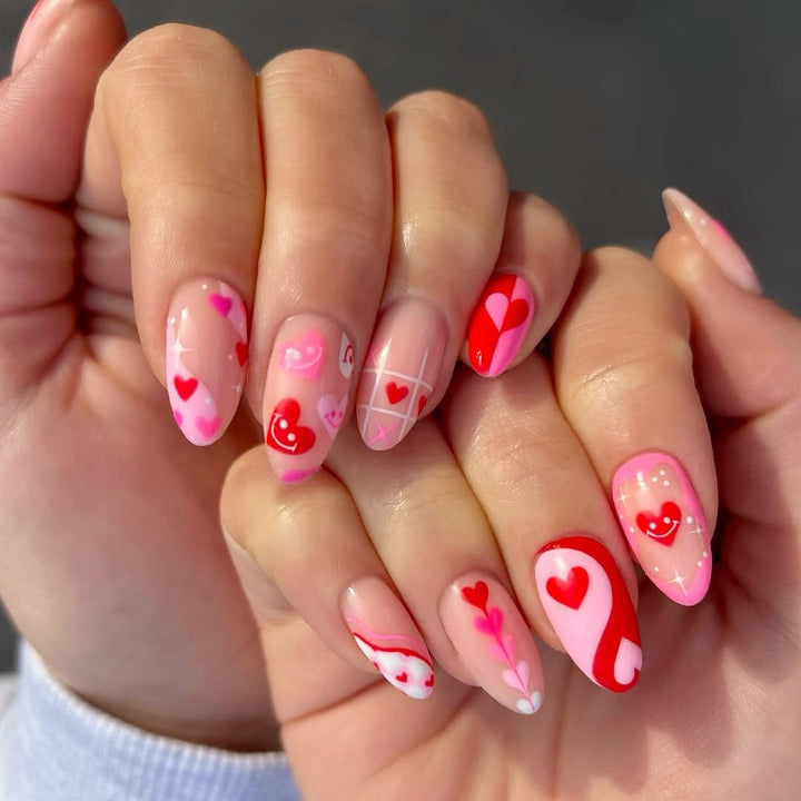 Acrylic nail set with romantic heart motifs and modern designs Stornfield
