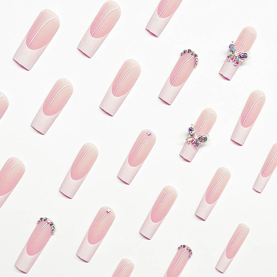 Acrylic nail set with elegant design and sparkling rhinestone accents Stornfield
