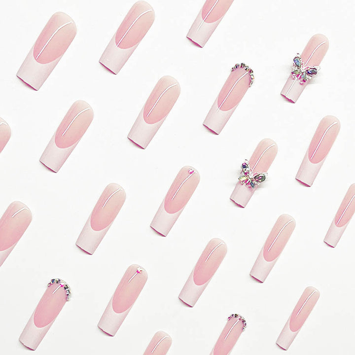 Acrylic nail set with elegant design and sparkling rhinestone accents Stornfield