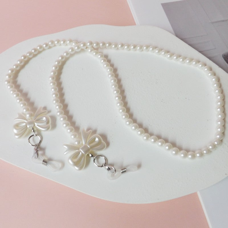 Elegant pearl glasses chain with bow pendants Stornfield