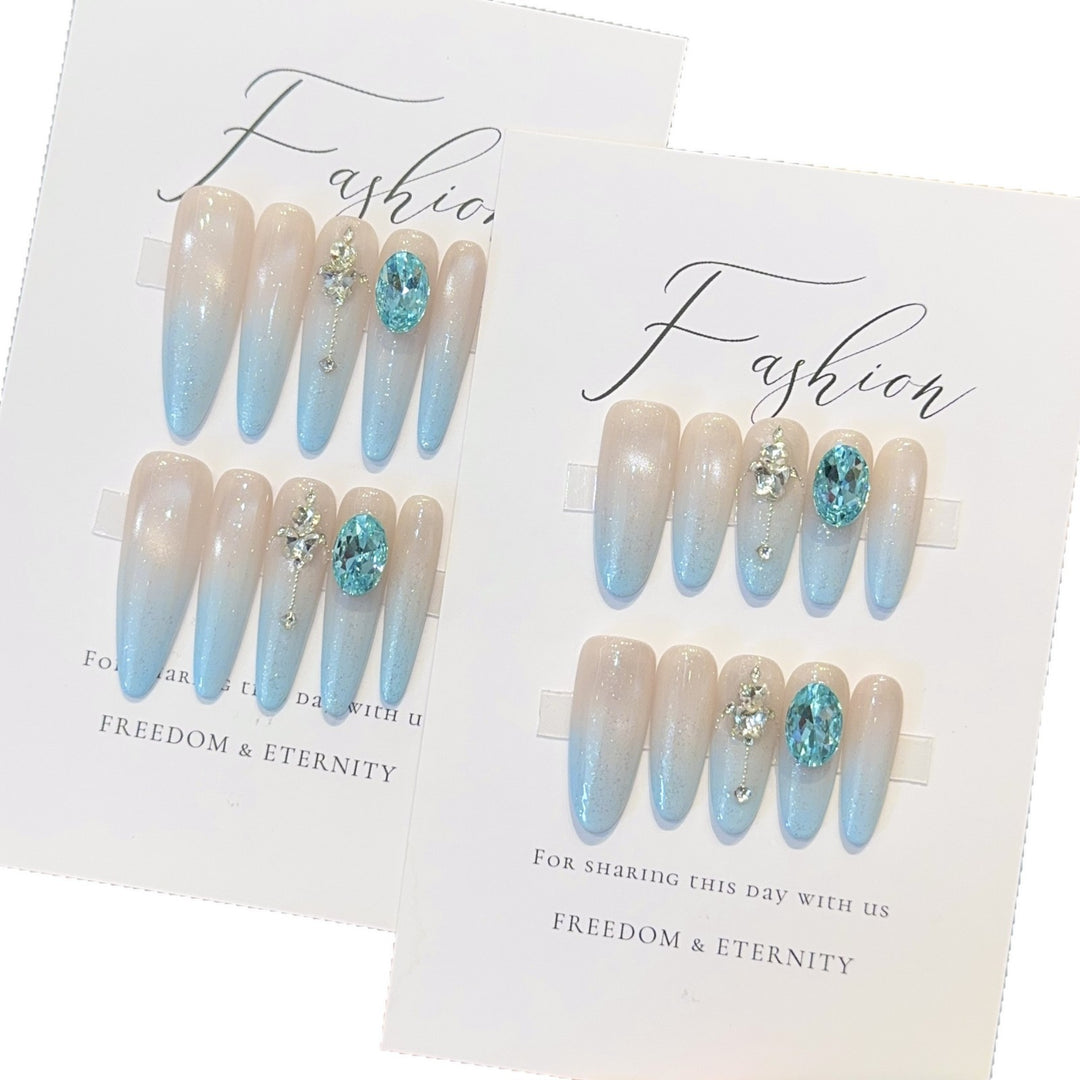 Glamorous artificial nails with sparkling rhinestone details Stornfield