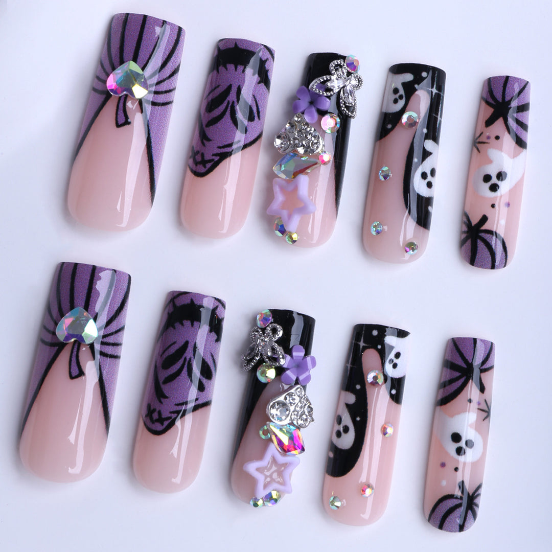 Artificail nails with creative Halloween design and glitter accents Stornfield