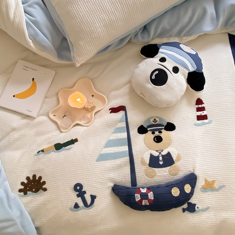 Children's bedding set with maritime embroidery and quilted bedspread