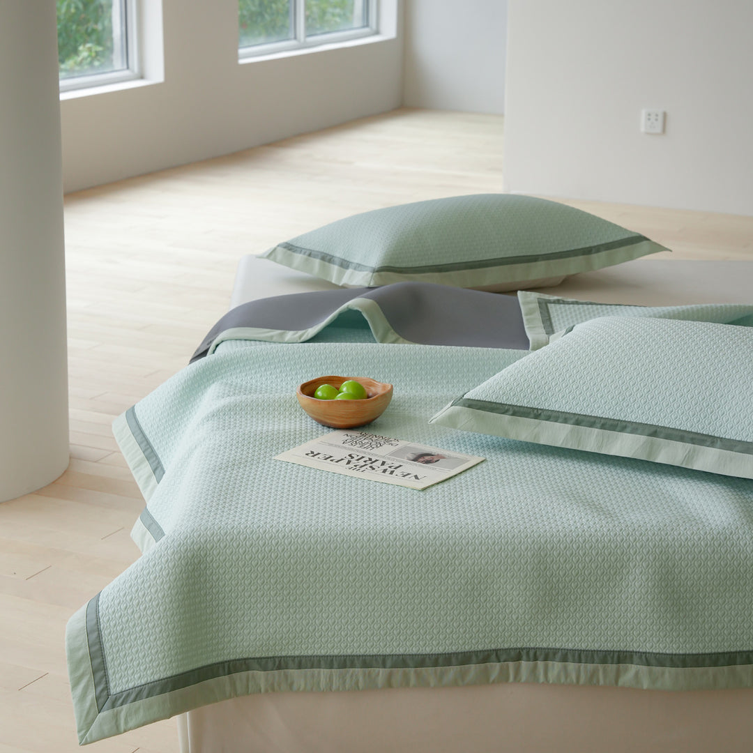 Quilted bedspread with textured waffle pattern and pillowcases