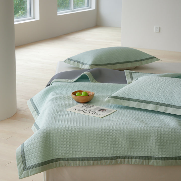 Quilted bedspread with textured waffle pattern and pillowcases