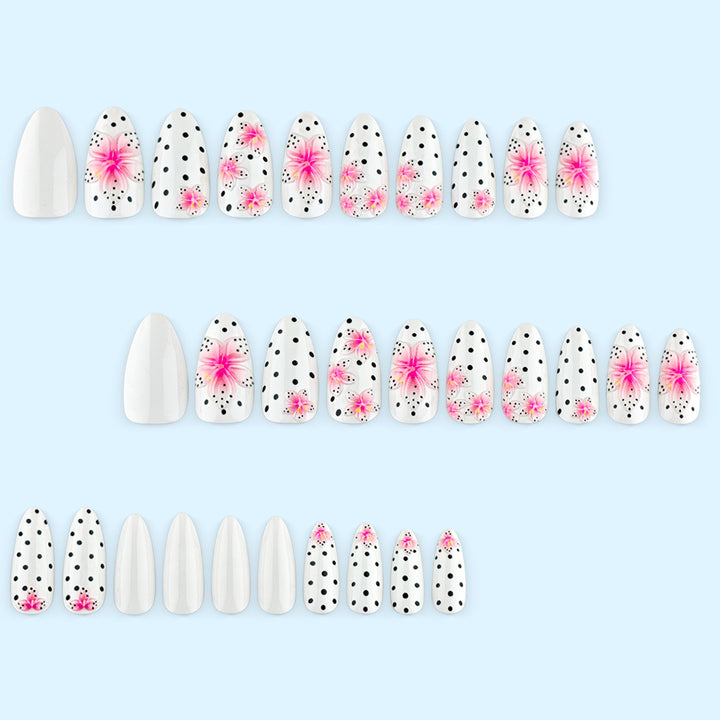 Artificial nail set with floral accents and polka dots Stornfield