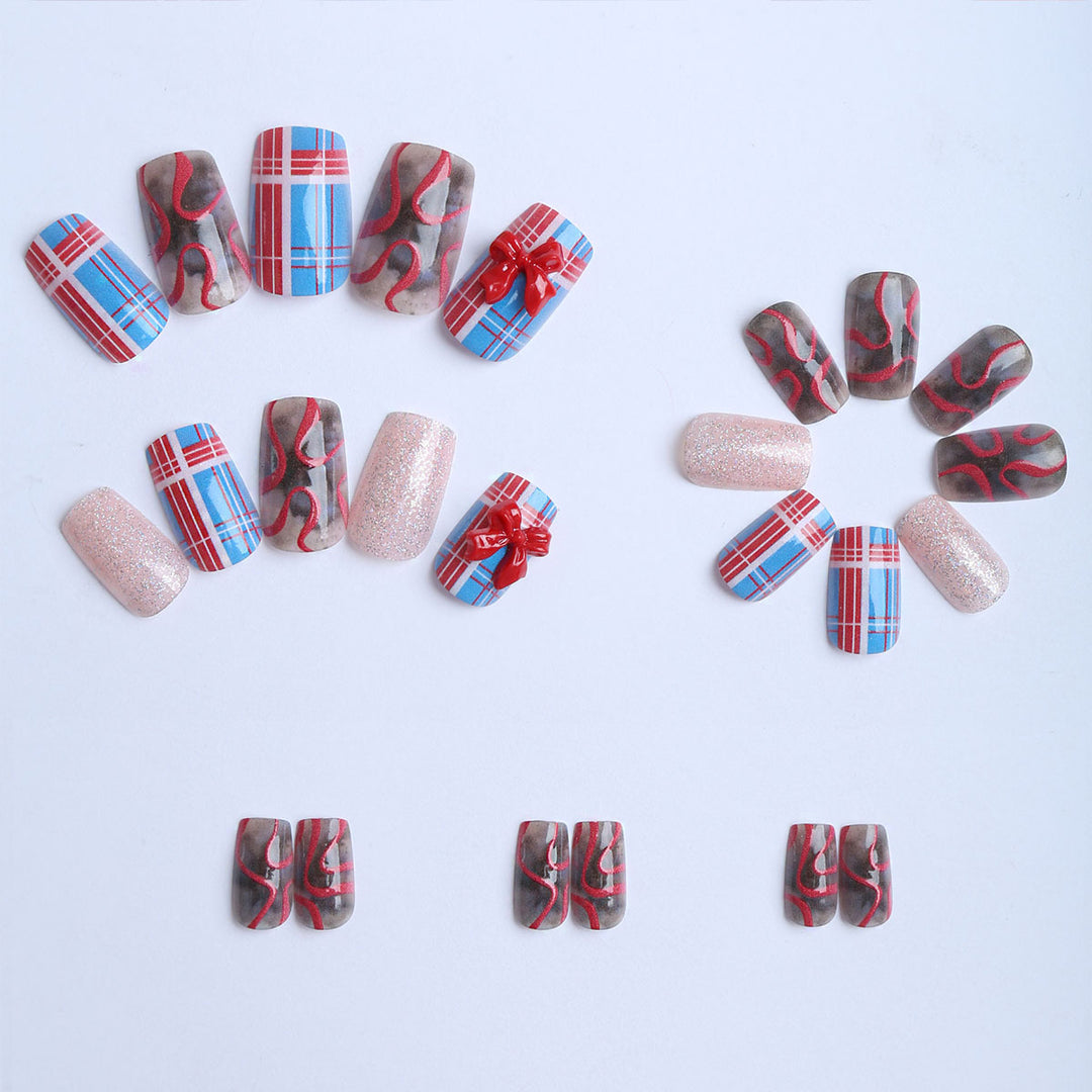 Artificial nails with festive gift design and glitter Stornfield