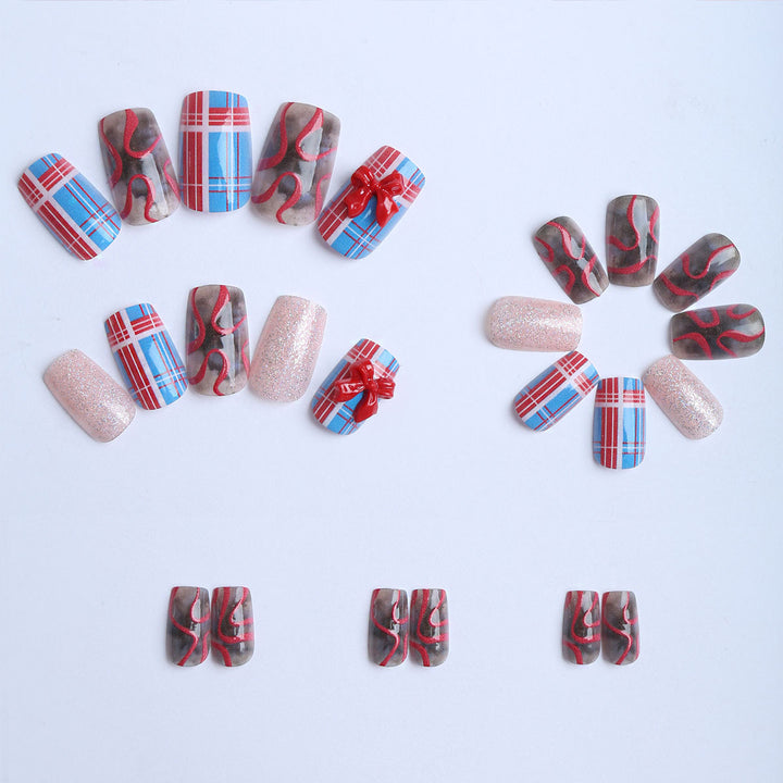 Artificial nails with festive gift design and glitter Stornfield