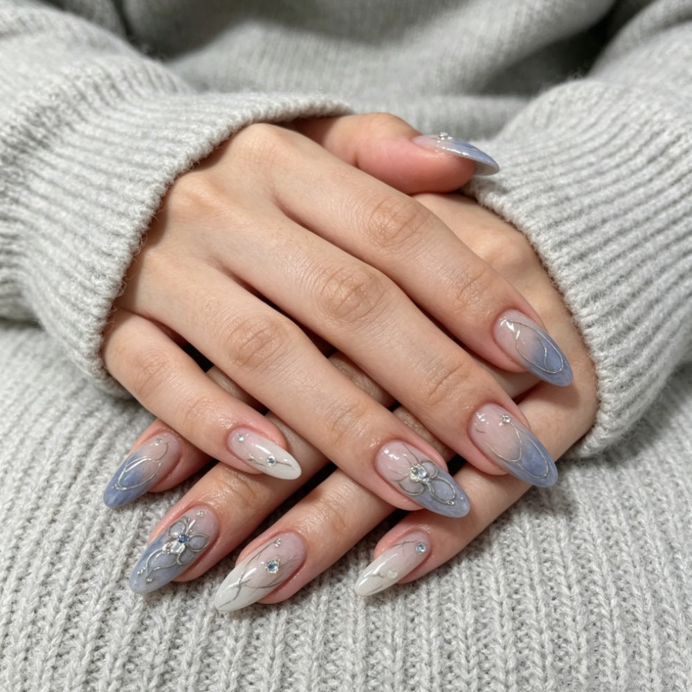 Artistic Press-On Nail Design with Floral and Gem Accents Stornfield